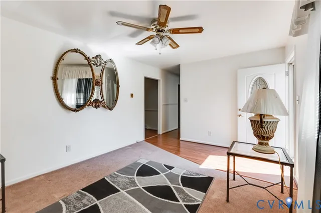 a living room with a piano and a table