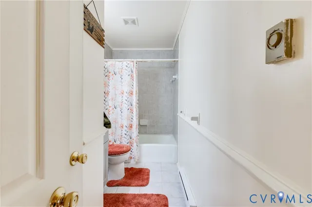 a bathroom with a bathtub and shower curtain