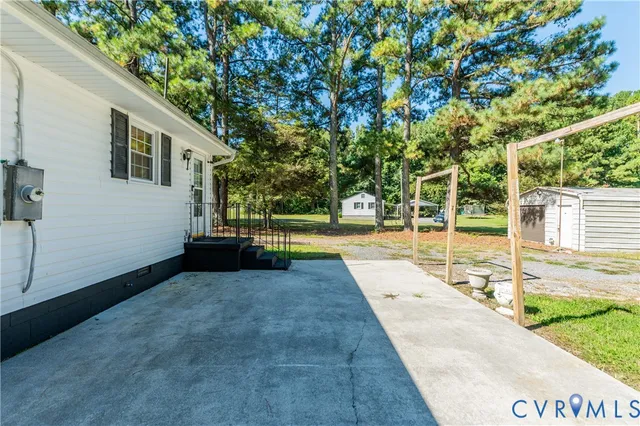 a view of backyard with green space