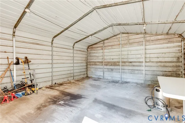 a view of a patio with table and chairs