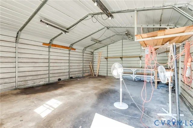 a view of a porch with furniture and a yard
