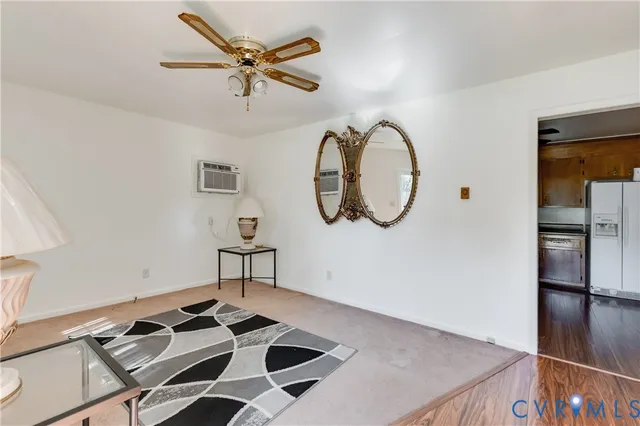 a view of a kitchen counter space and a chandelier fan
