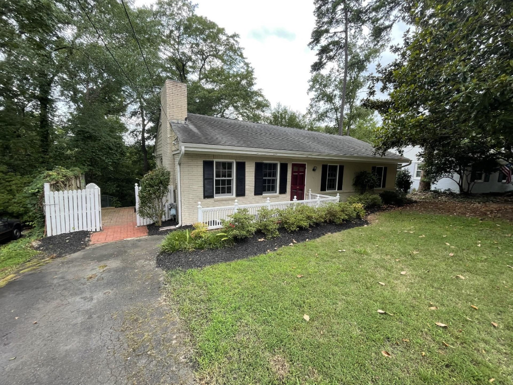 200 East Drewry Lane Raleigh, NC 27609 - Photo 1 of 22 a view of a house with a yard and large tree