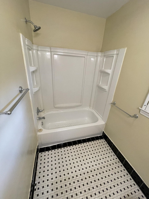 200 East Drewry Lane Raleigh, NC 27609 - Photo 12 of 22 a bathroom with a bathtub and a shower