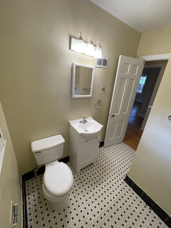 200 East Drewry Lane Raleigh, NC 27609 - Photo 13 of 22 a bathroom with a sink toilet and mirror