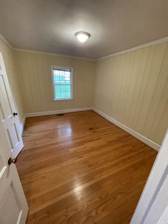200 East Drewry Lane Raleigh, NC 27609 - Photo 18 of 22 an empty room with wooden floor and windows