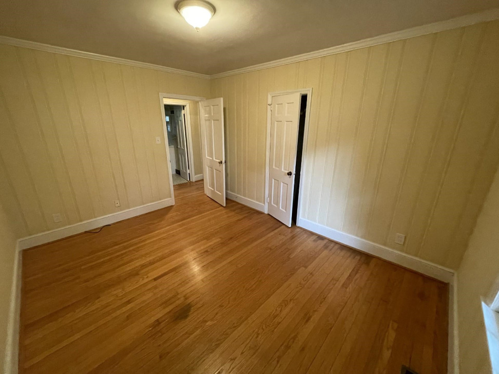 200 East Drewry Lane Raleigh, NC 27609 - Photo 19 of 22 a view of an empty room with wooden floor