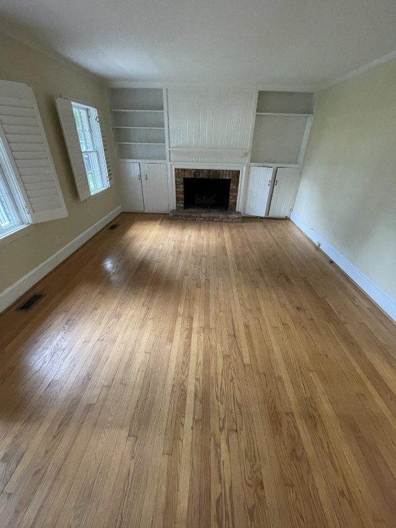 200 East Drewry Lane Raleigh, NC 27609 - Photo 20 of 22 a view of a livingroom with wooden floor and staircase
