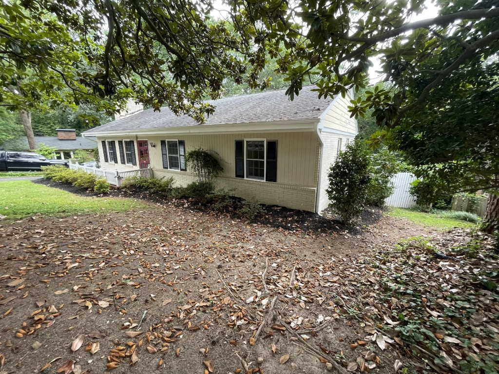 200 East Drewry Lane Raleigh, NC 27609 - Photo 2 of 22 a front view of a house with a garden