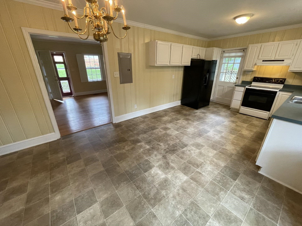 200 East Drewry Lane Raleigh, NC 27609 - Photo 8 of 22 a view of a kitchen with a sink and refrigerator