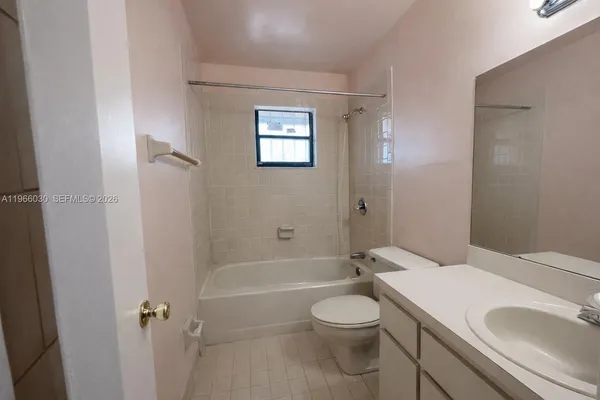 a bathroom with a toilet a sink and a bathtub