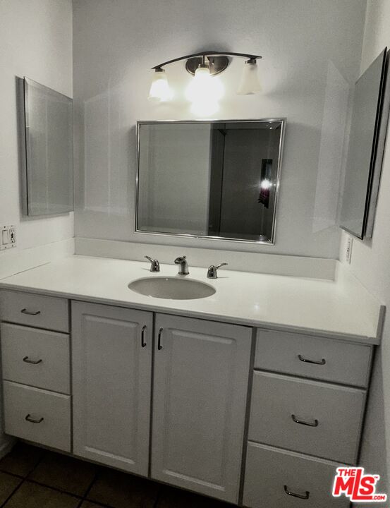 1119 Raintree Circle Culver City, CA 90230 - Photo 4 of 13 a bathroom with a sink and a mirror