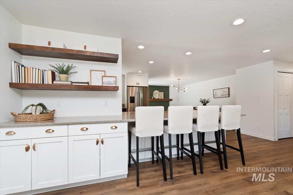 2217 North Middlefield Road Boise, ID 83704 - Photo 11 of 34 Kitchen area featuring a built-in countertop with white cabinetry and floating wood-finish shelving