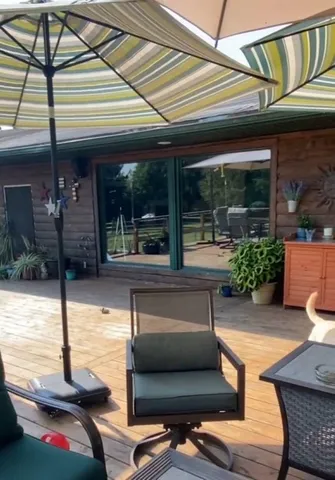 a view of a chairs and table in the patio