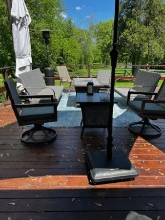 a view of a backyard with sitting area