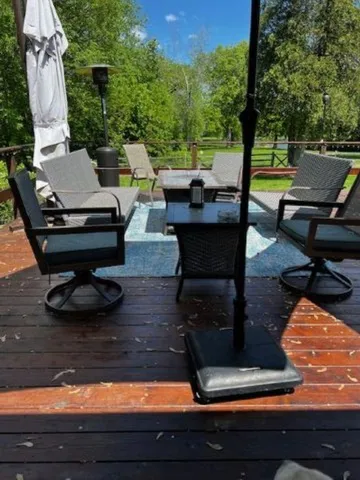 a view of a backyard with sitting area