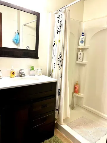 a bathroom with a sink and a mirror
