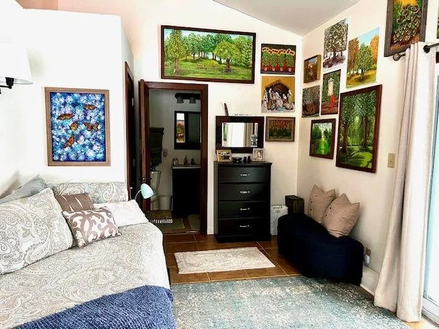 a bedroom with furniture and a window