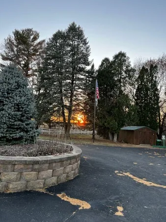 a view of fountain with tree in the background