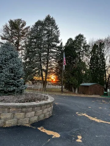 a view of fountain with tree in the background