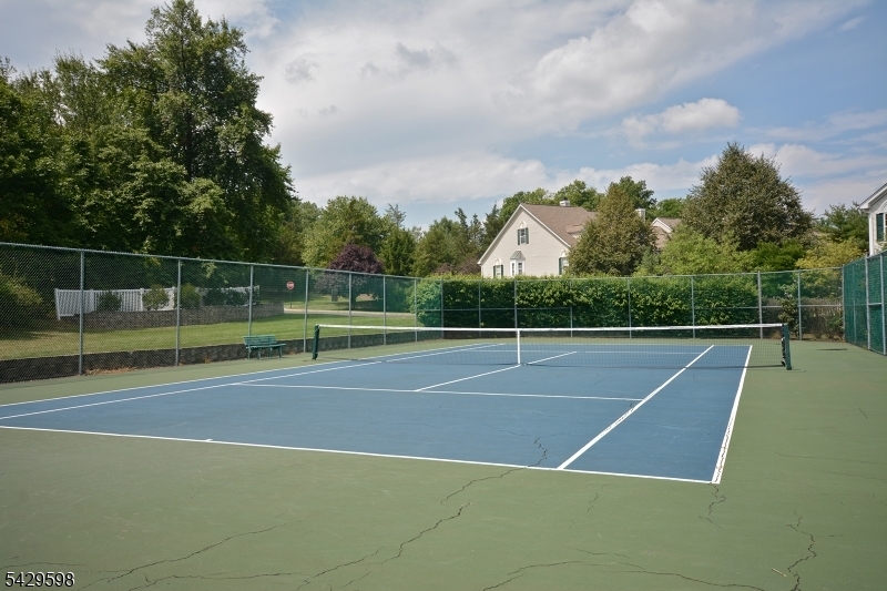 105 Well Sweep Road, Unit 105 Whitehouse Station, NJ 08889 - Photo 21 of 22 a view of a tennis court