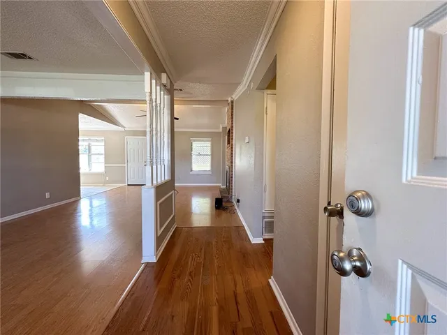 a kitchen with stainless steel appliances granite countertop a stove and a refrigerator