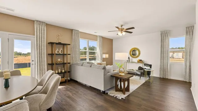 a living room with furniture and a window