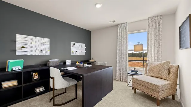 a dining room with furniture and a window