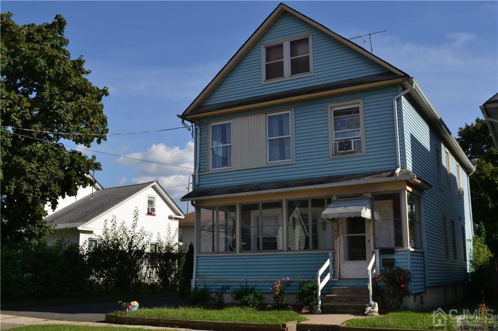 635 Front Street Dunellen, NJ 08812 - Photo 1 of 18 a view of small house with yard and plants