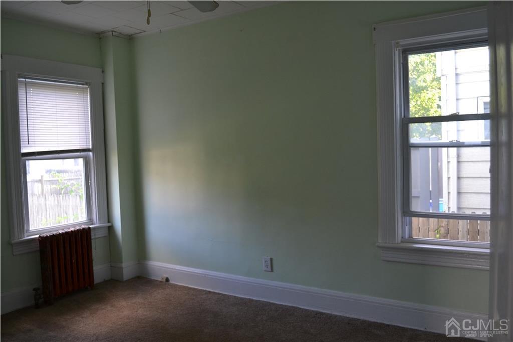 635 Front Street Dunellen, NJ 08812 - Photo 11 of 18 an empty room with a window