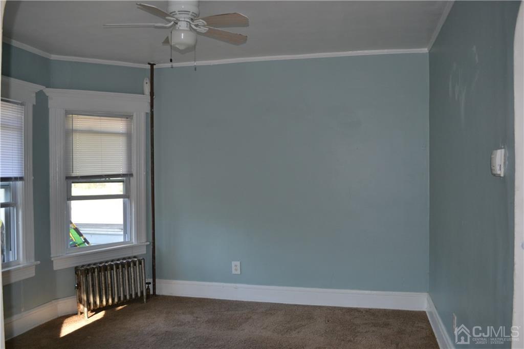 635 Front Street Dunellen, NJ 08812 - Photo 14 of 18 an empty room with windows