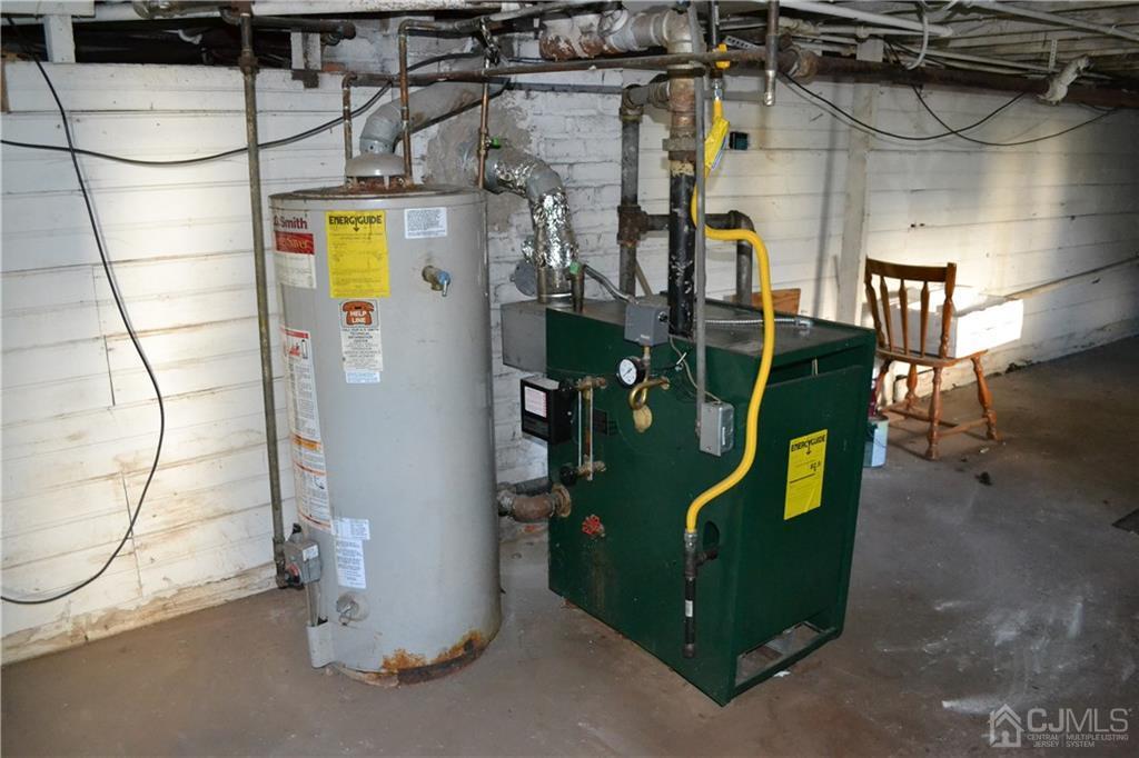 635 Front Street Dunellen, NJ 08812 - Photo 16 of 18 a view of a room with water heater and a shower