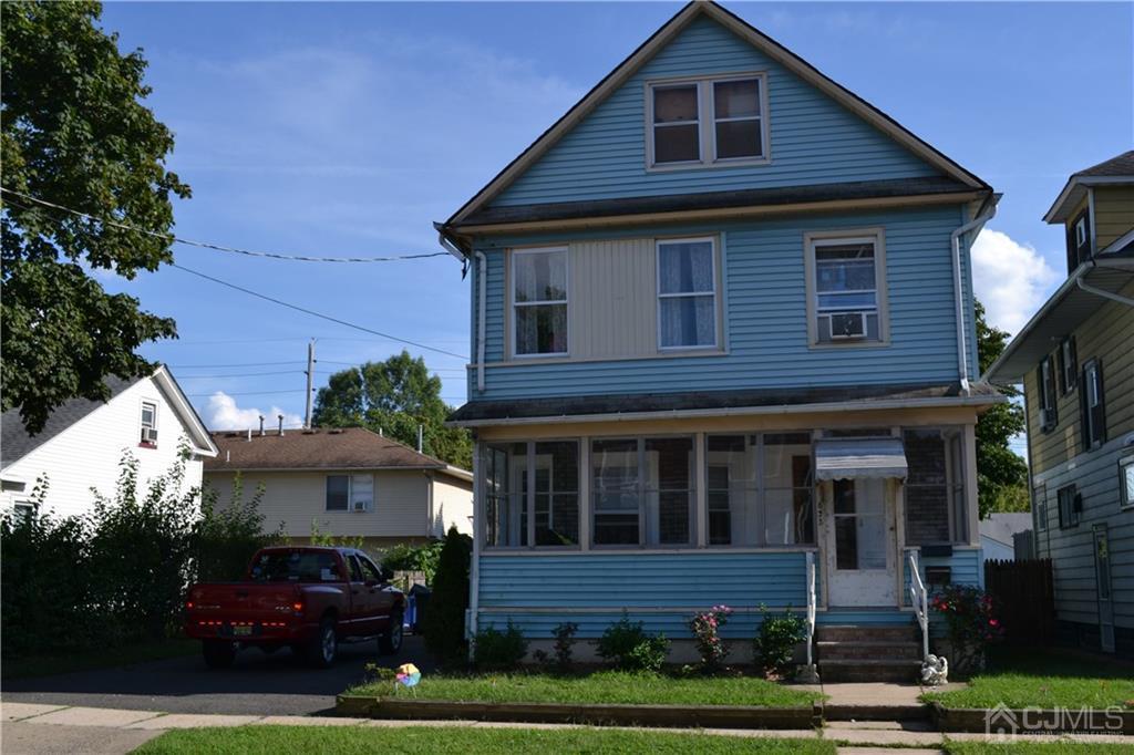 635 Front Street Dunellen, NJ 08812 - Photo 17 of 18 a front view of a house with garden