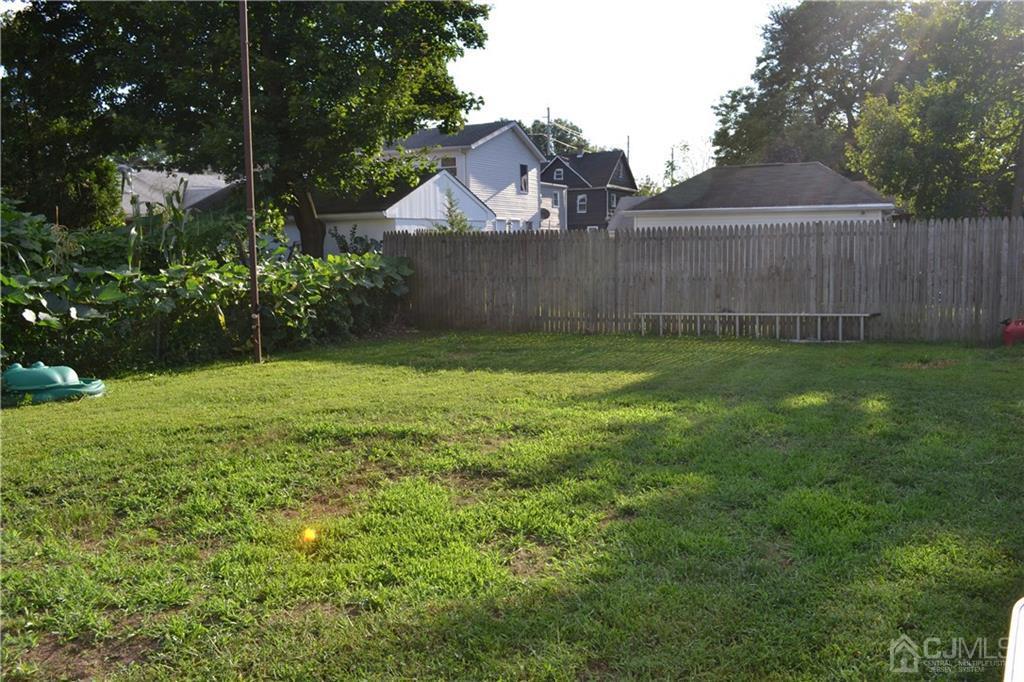 635 Front Street Dunellen, NJ 08812 - Photo 4 of 18 a view of a backyard with a garden