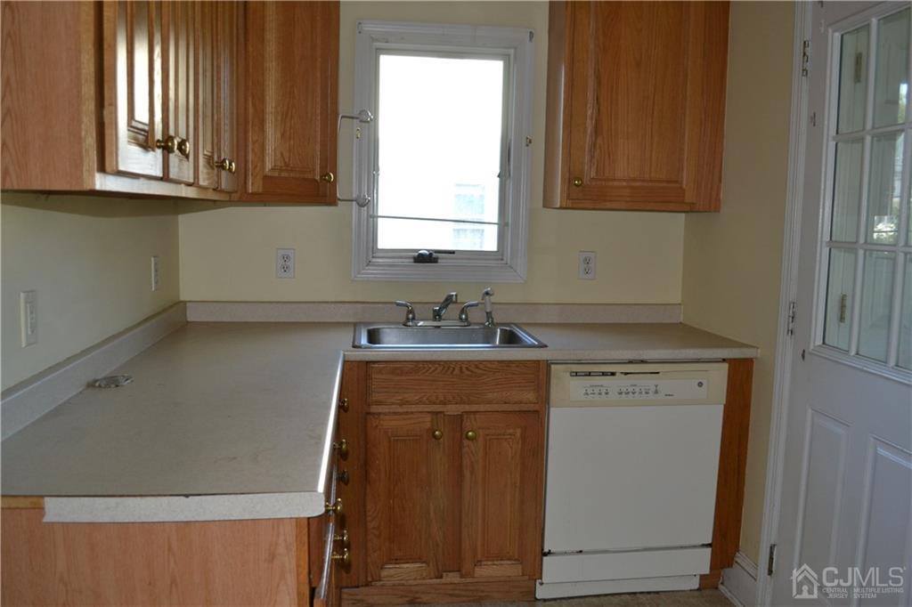 635 Front Street Dunellen, NJ 08812 - Photo 5 of 18 a view of a kitchen with window and cabinets