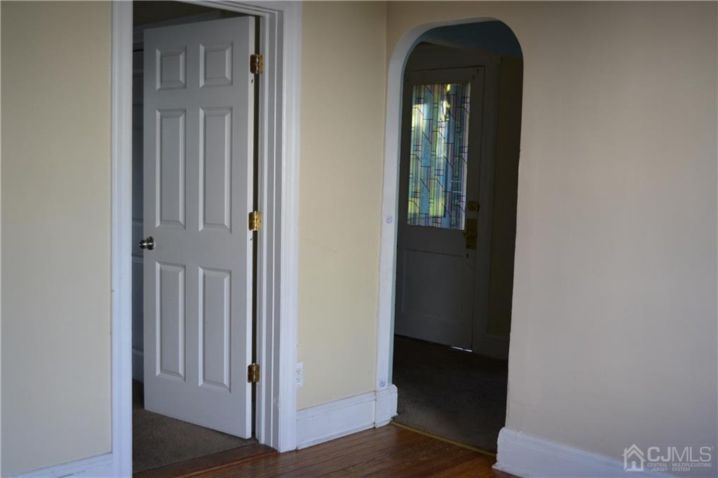 635 Front Street Dunellen, NJ 08812 - Photo 8 of 18 a view of a hallway with wooden floor
