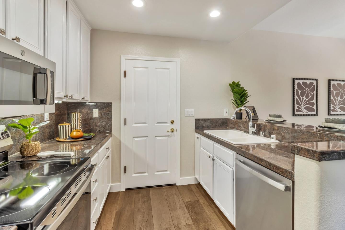 72 Cannery Circle Campbell, CA 95008 - Photo 11 of 31 a kitchen with a sink stove and refrigerator