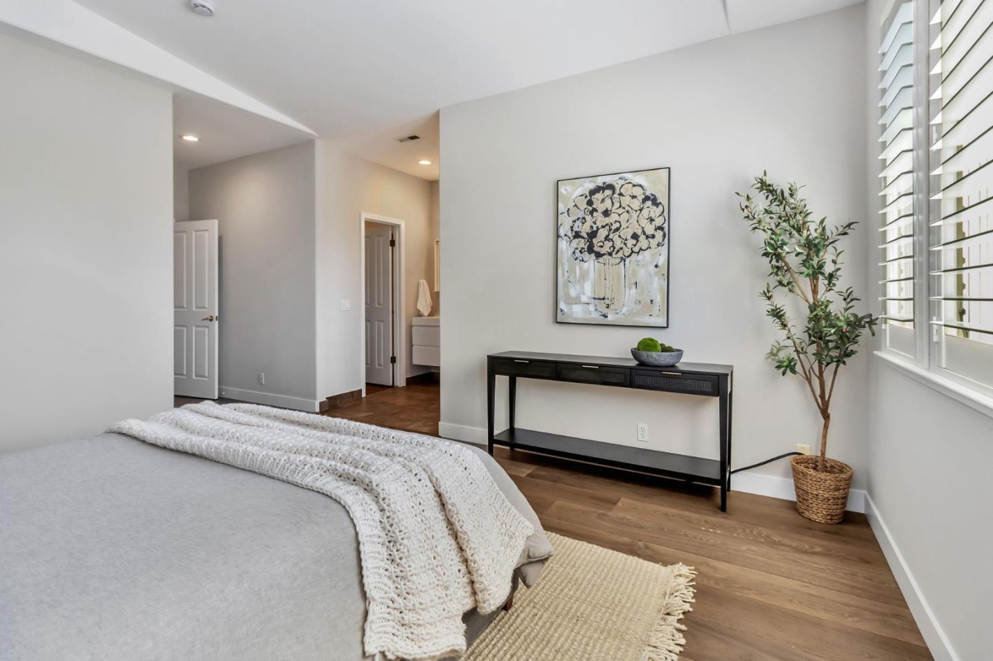 72 Cannery Circle Campbell, CA 95008 - Photo 19 of 31 a bedroom with a bed and a potted plant