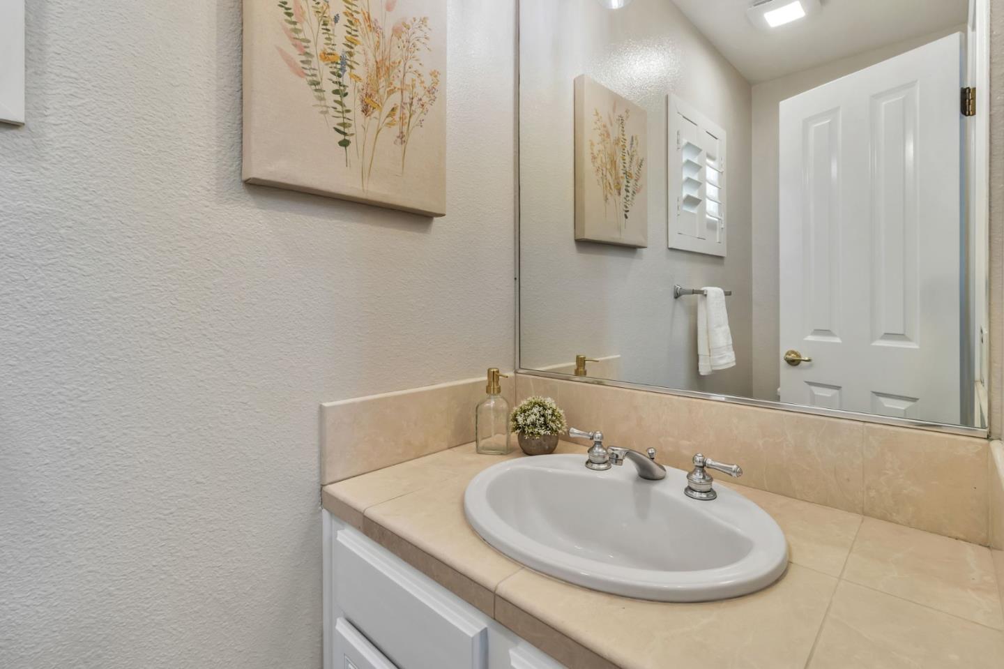 72 Cannery Circle Campbell, CA 95008 - Photo 24 of 31 a bathroom with a sink and a mirror