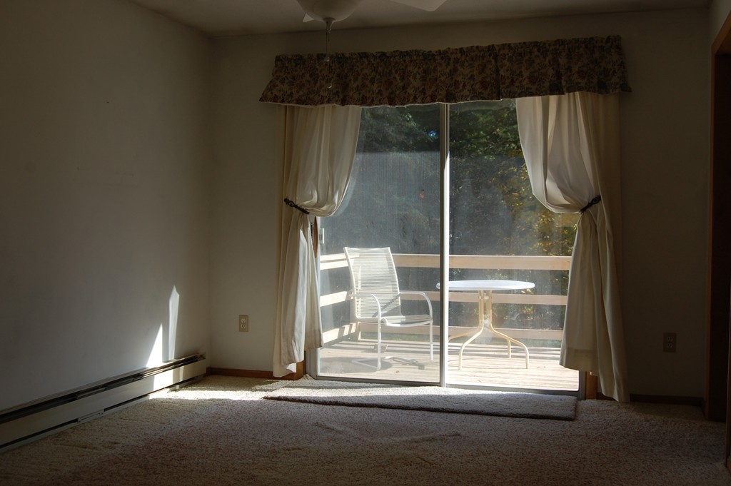 43 Winsor Road Lancaster, MA 01523 - Photo 8 of 19 view of empty room with wooden floor and fan