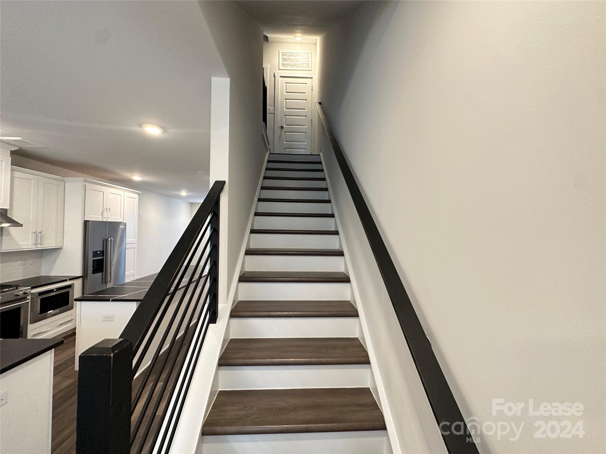 2124 Terwilliger Trail Charlotte, NC 28203 - Photo 14 of 36 a view of entryway and hall with wooden floor