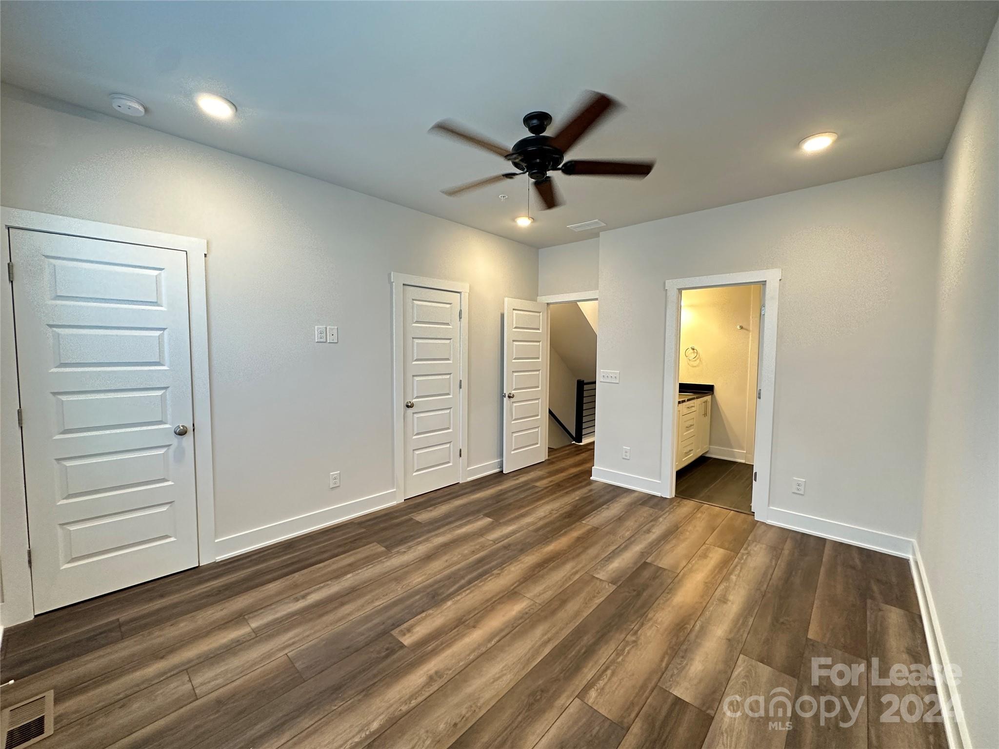 2124 Terwilliger Trail Charlotte, NC 28203 - Photo 16 of 36 a view of a livingroom with a hardwood & a ceiling fan