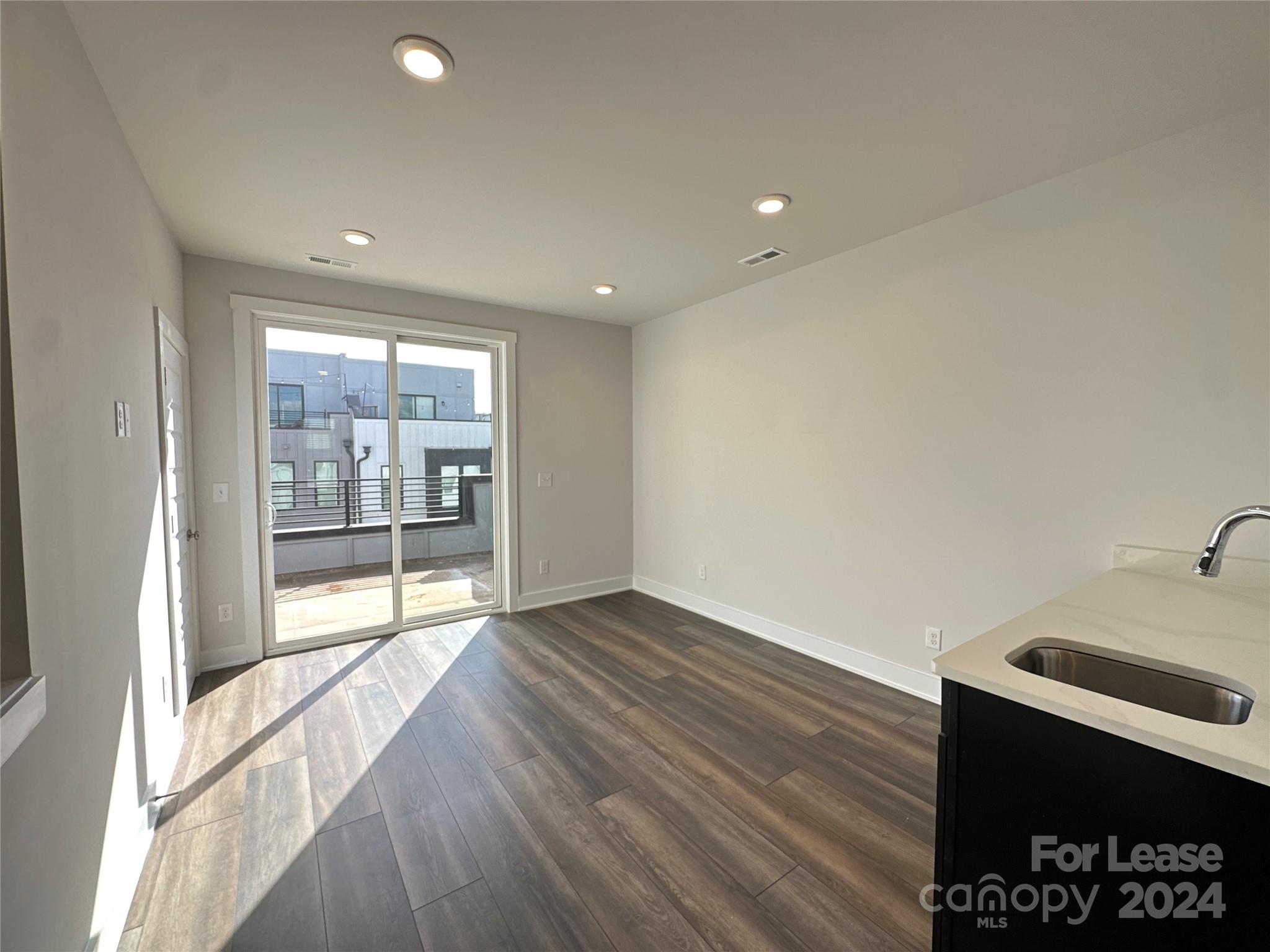 2124 Terwilliger Trail Charlotte, NC 28203 - Photo 26 of 36 a view of empty room with wooden floor
