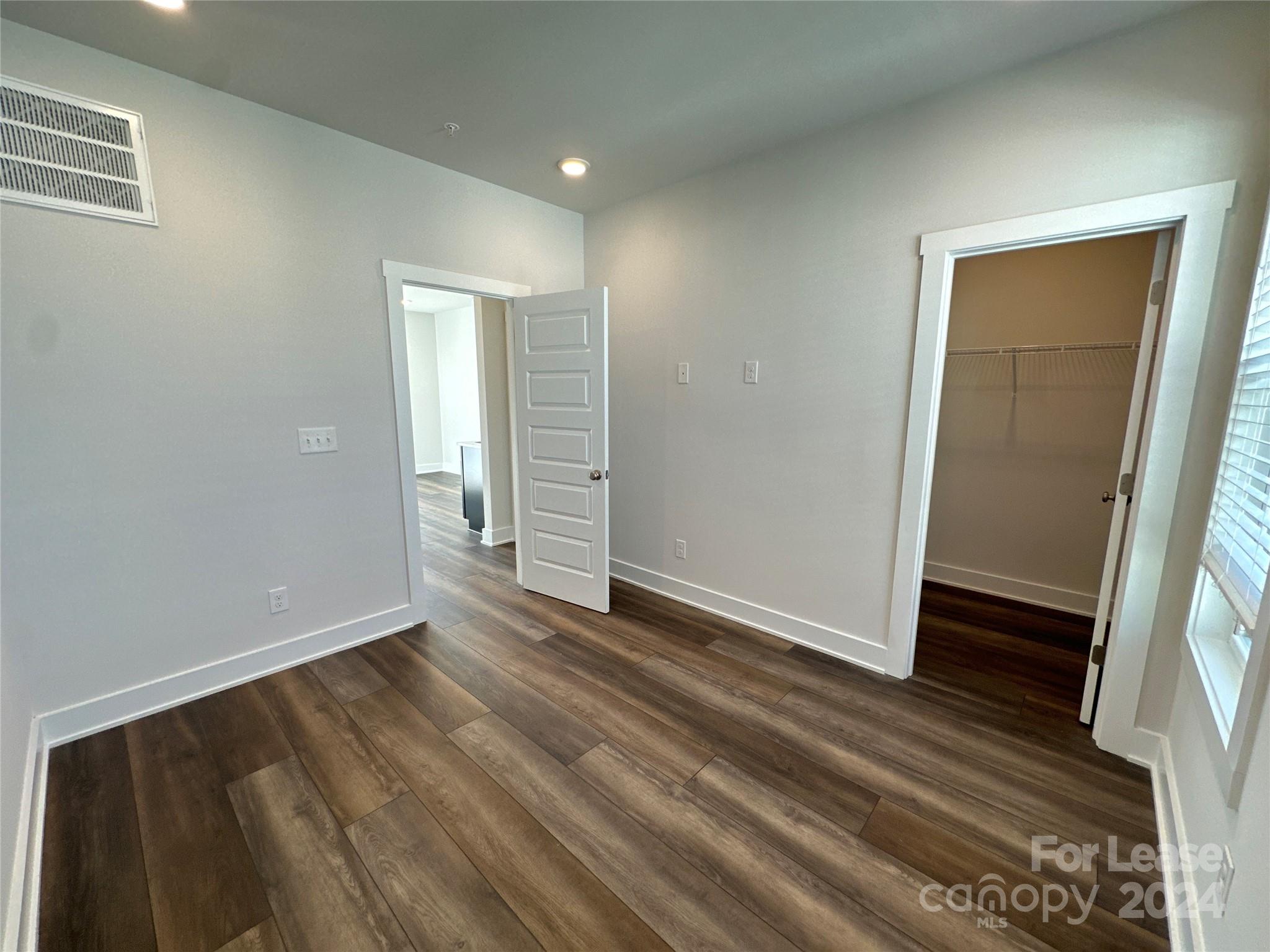 2124 Terwilliger Trail Charlotte, NC 28203 - Photo 30 of 36 an empty room with wooden floor and closet