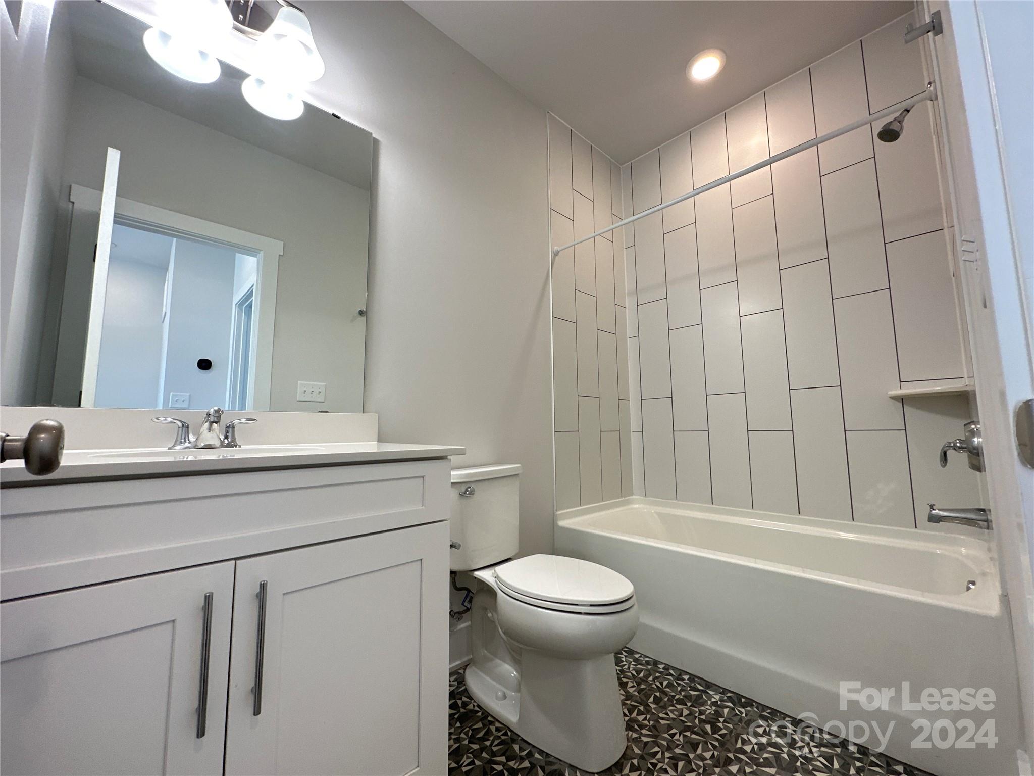 2124 Terwilliger Trail Charlotte, NC 28203 - Photo 31 of 36 a bathroom with a sink a toilet and a bathtub