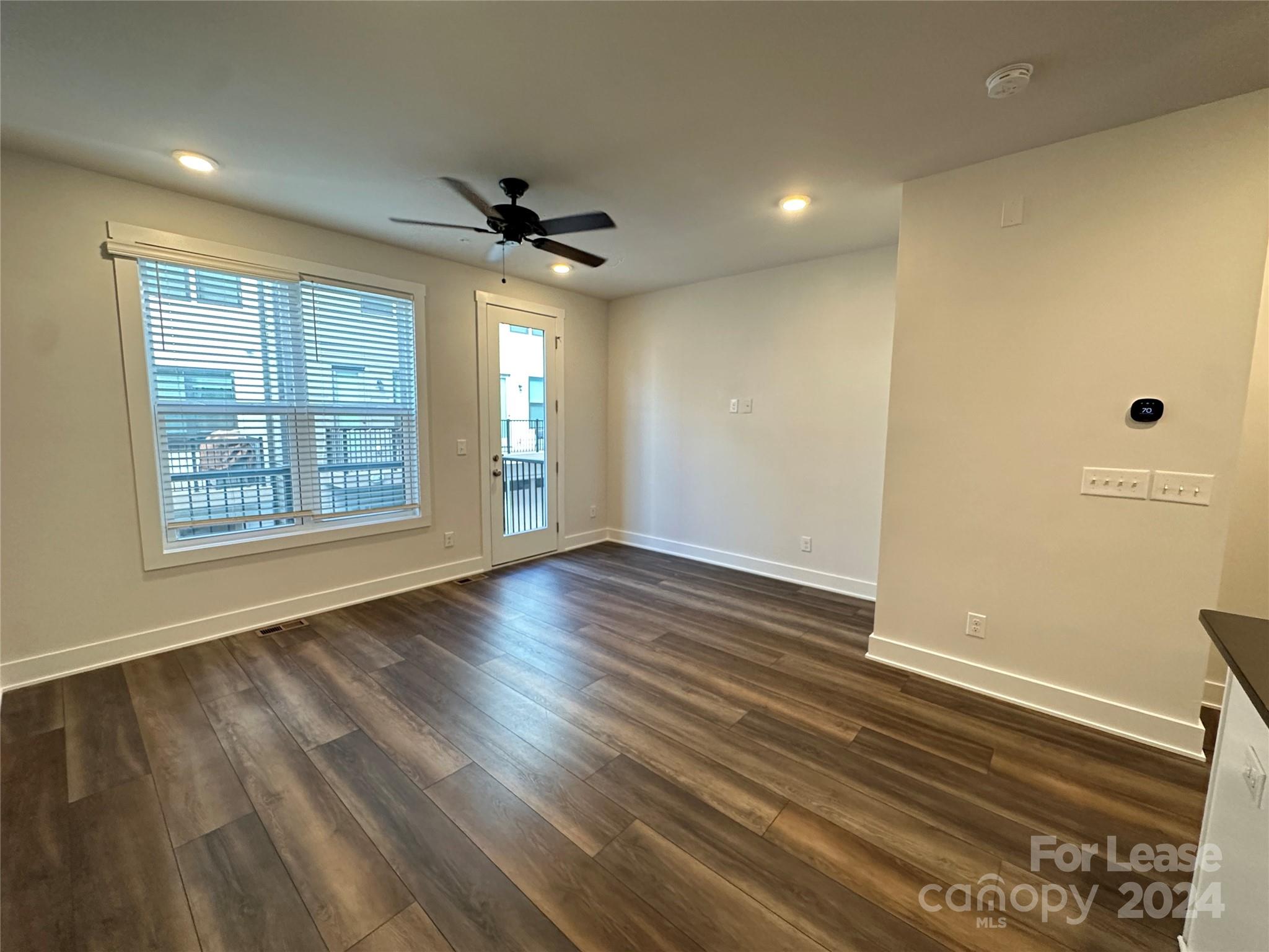 2124 Terwilliger Trail Charlotte, NC 28203 - Photo 5 of 36 a view of livingroom with hardwood floor and a ceiling fan