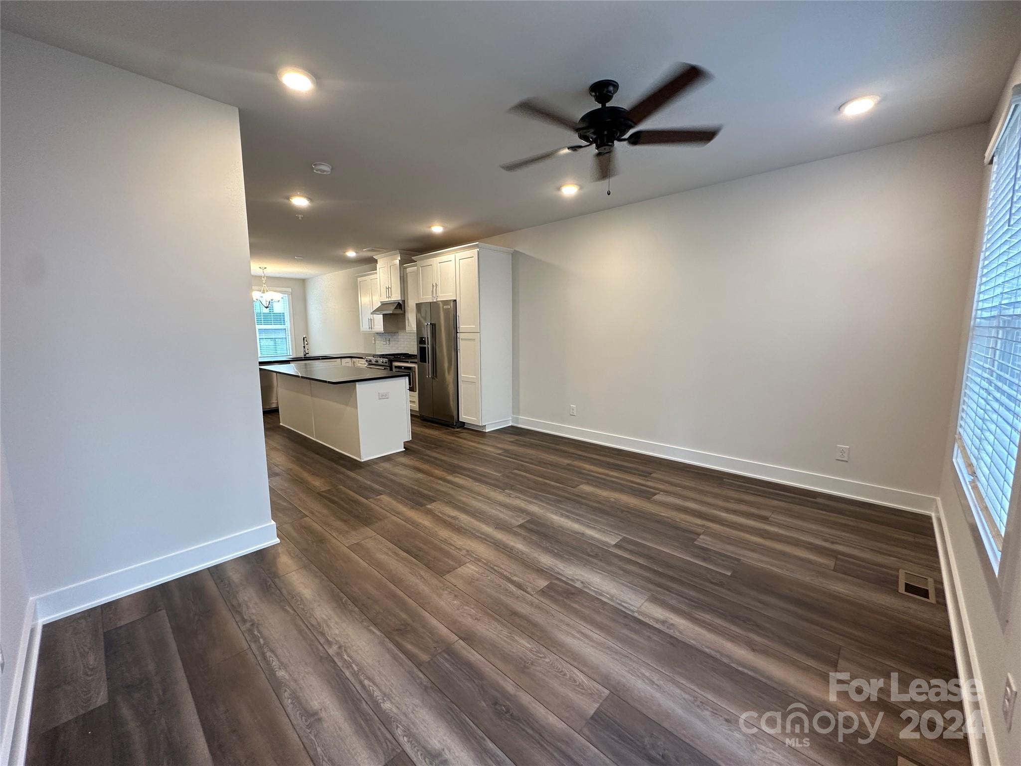 2124 Terwilliger Trail Charlotte, NC 28203 - Photo 7 of 36 wooden floor in an empty room with a window