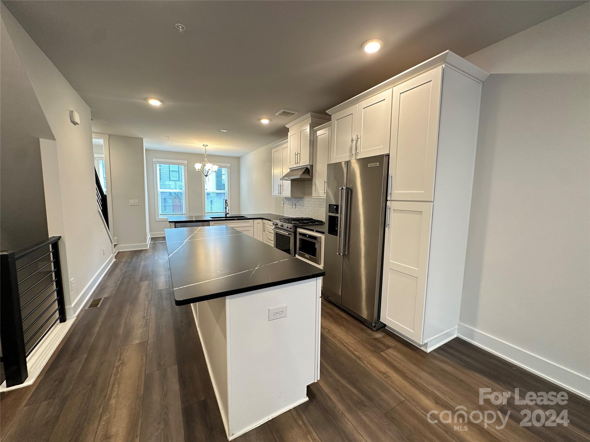 2124 Terwilliger Trail Charlotte, NC 28203 - Photo 8 of 36 a kitchen with granite countertop a refrigerator and a sink