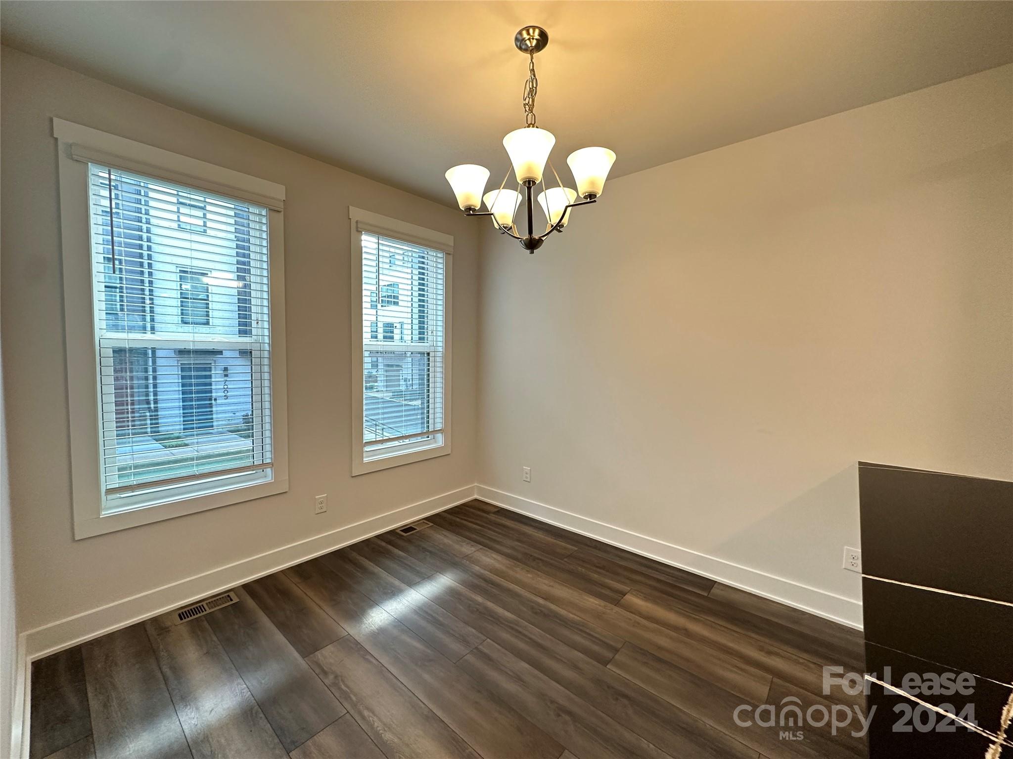 2124 Terwilliger Trail Charlotte, NC 28203 - Photo 10 of 36 a view of a room with wooden floor and a window
