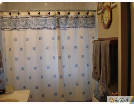376 Old Post Road Edison, NJ 08817 - Photo 4 of 6 a bathroom with a shower and a sink